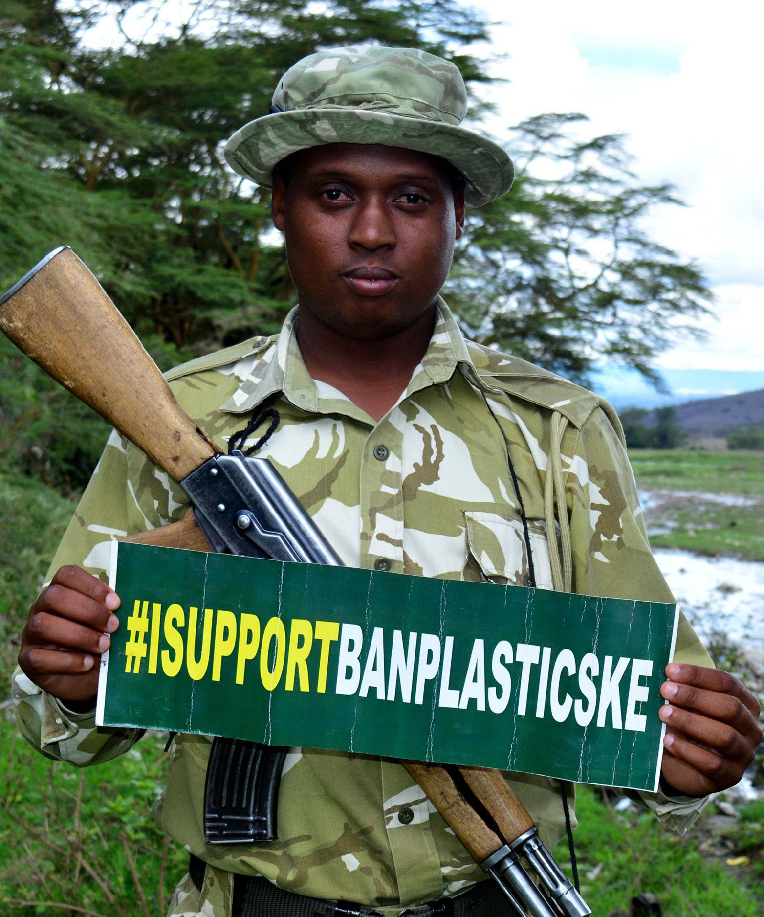 A soldier holding '#IsupportBanPlasticKE' banner